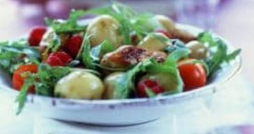 Fresh salad with cherry tomatoes, potatoes, and greens