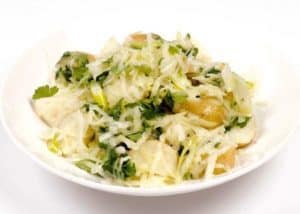 Bowl of chicken and vegetable pasta with herbs