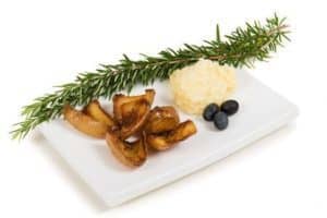 Plate with roasted mushrooms, mashed potatoes, blueberries, and rosemary.