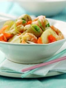 Bowl of shrimp and vegetable stir-fry with chopsticks