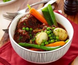 Hearty beef stew with potatoes, carrots, peas, and green beans