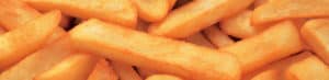 Close-up of crispy golden French fries pile.