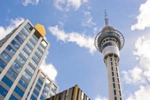 Sky Tower with surrounding buildings under blue sky