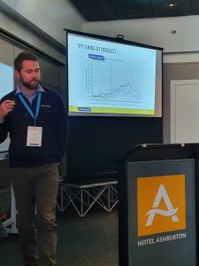 Man presenting product timing chart at Hotel Ashburton conference room