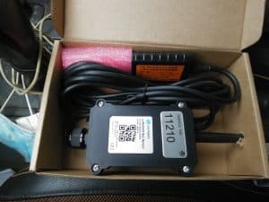 LoRaWAN soil moisture sensor device with long black cable in box