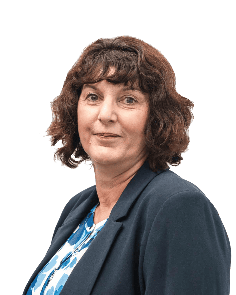 Middle-aged woman with curly brown hair in blazer