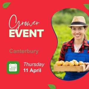 Smiling female farmer holding potatoes for grower event.