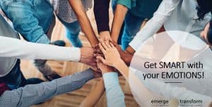Group of diverse people stacking hands in teamwork gesture