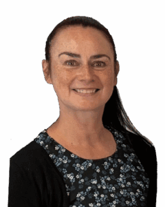 Smiling woman with dark hair wearing floral top and black cardigan