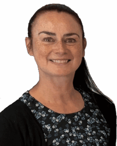 Smiling woman with dark hair wearing floral dress and cardigan