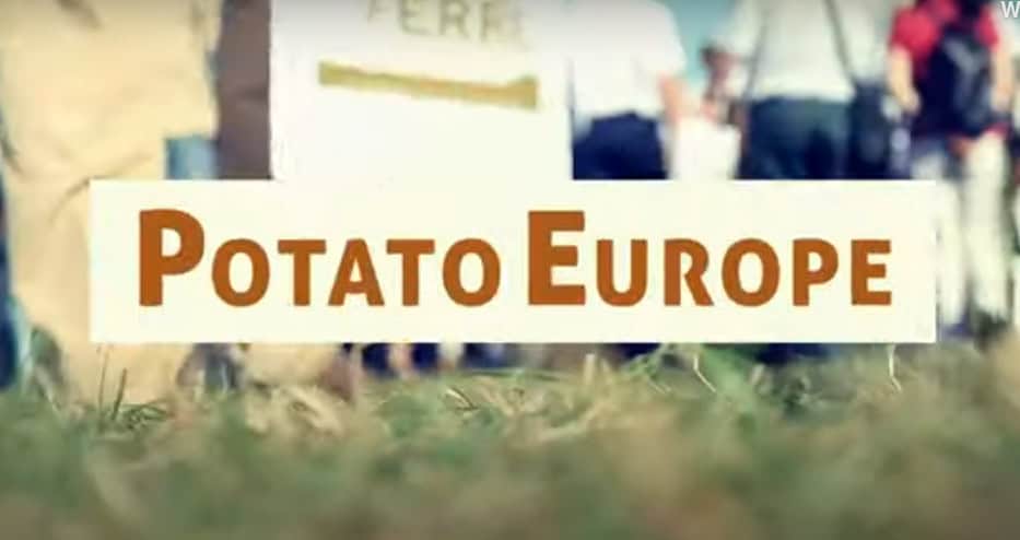 Potato Europe event sign with people standing outdoors.
