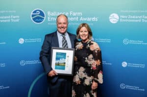 Man and woman posing with award certificate at Ballance Farm Environment Awards event.