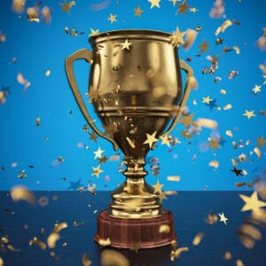 Golden trophy with star-shaped confetti celebration background