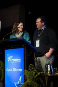 Two people speaking at Potatoes New Zealand Gala Dinner event.
