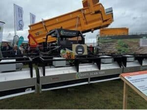 Agricultural machinery at outdoor farming equipment exhibition.