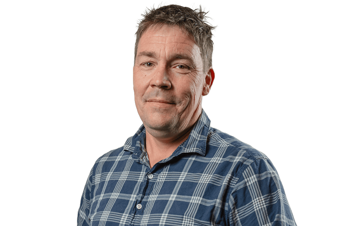 Middle-aged man with short hair wearing plaid shirt isolated