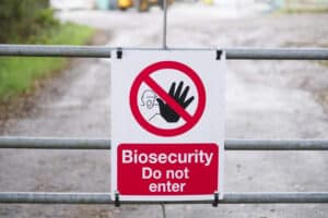 Biosecurity warning sign on gate saying do not enter.